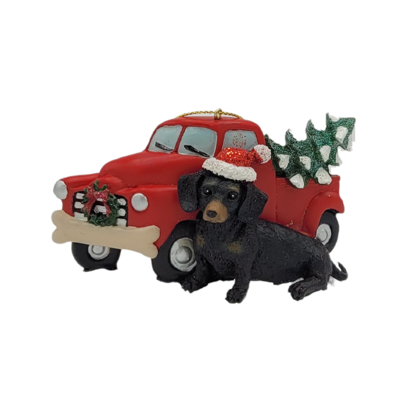 Weihnachtsdekorationsfigur Dackel vor Auto