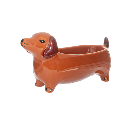 Keramik-Schmuckschale in Form eines braunen Dackels mit glänzender Oberfläche.
