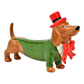 Keramikfigur eines Dackels in grünem Frack mit roter Fliege und rotem Zylinderhut, in aufrechter Haltung mit vornehmem Blick.