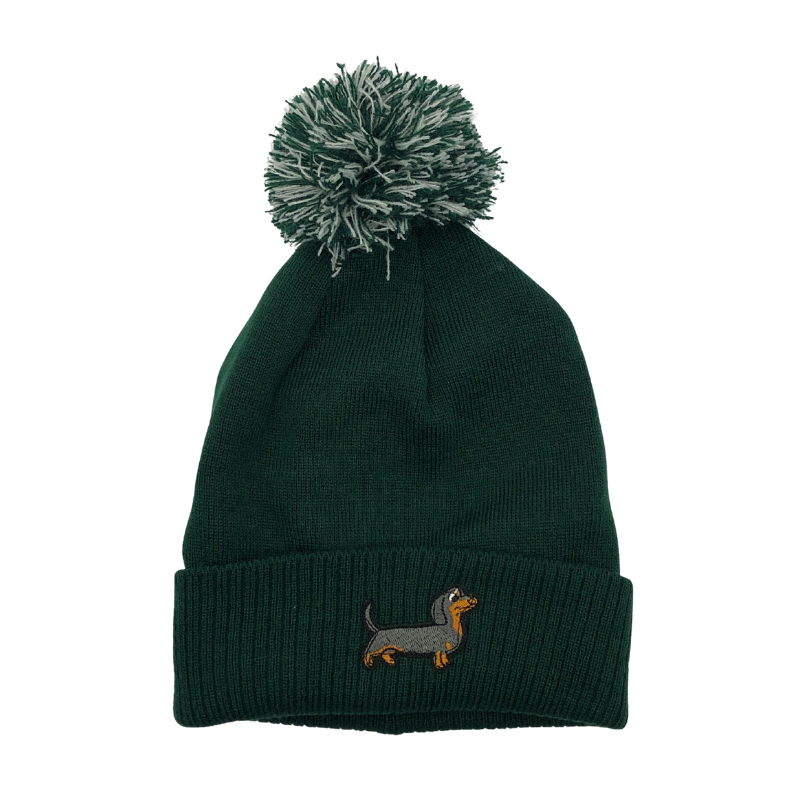 Strickmütze mit Bommel und gesticktem Dackelmotiv auf dem Umschlag, erhältlich in neun verschiedenen Farben.