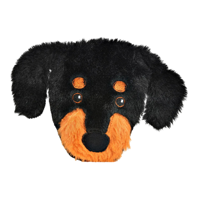 Plüschiger Taschenwärmer in Form eines Dackelkopfes mit schwarzem Fell und braunen Details, inklusive rotem Wärmekissen im Inneren.