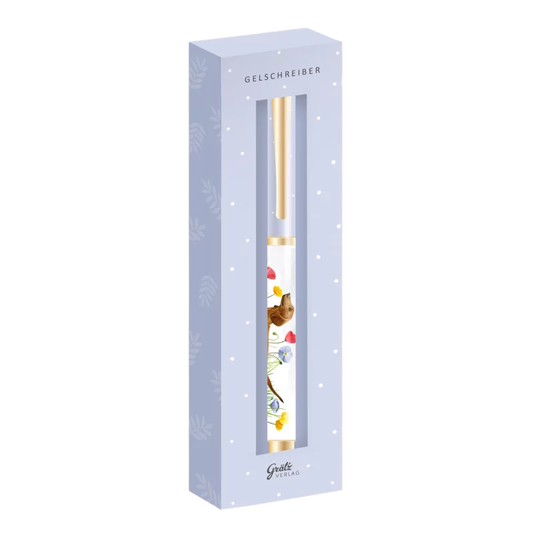 Eleganter Gelschreiber in Geschenkverpackung mit Dackelmotiv und bunten Blumen, goldener Clip und Spitze; sichtbar durch ein Sichtfenster in hellblauer Verpackung mit weißen Punkten.