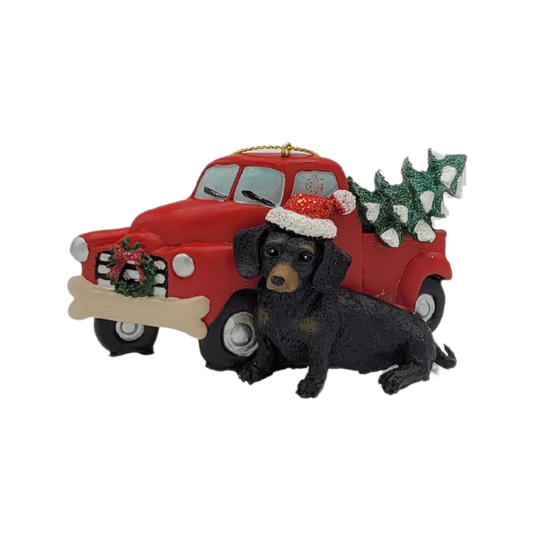 Weihnachtsdekorationsfigur Dackel vor Auto